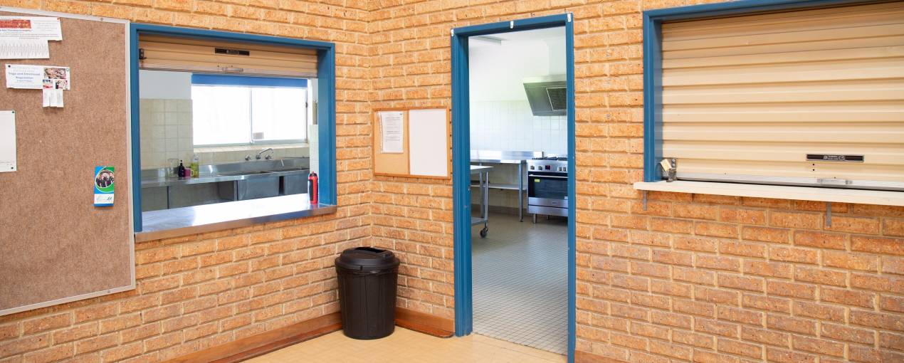 There is a serving window from the Kitchen to the Main Hall