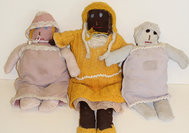 Three old knitted dolls from the Heathcote collection