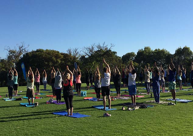 Group of people participating in Yoga