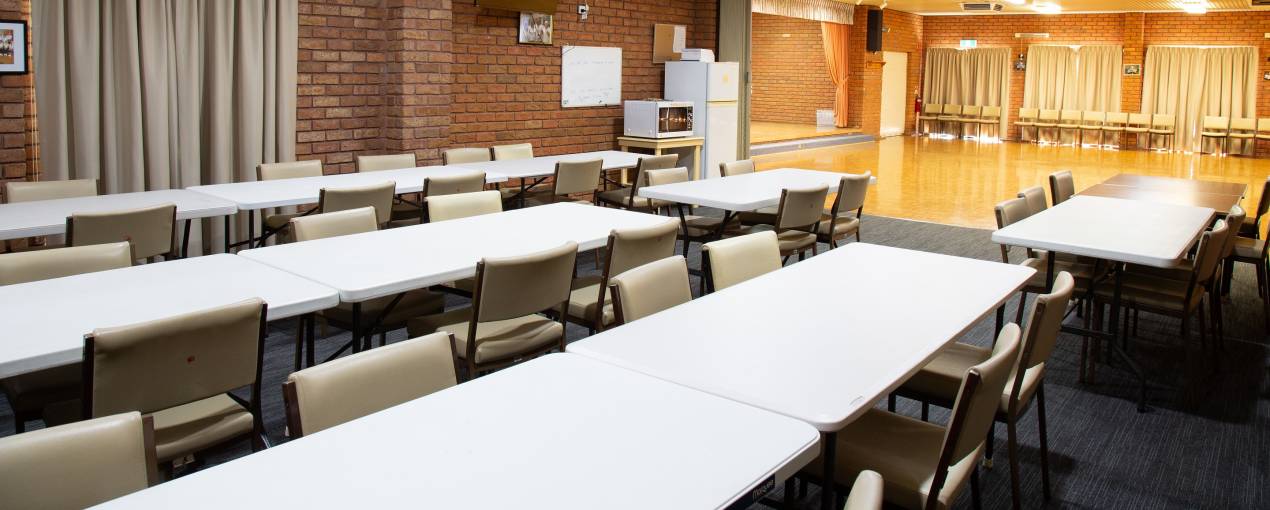 The carpeted area to the side has tables and chairs