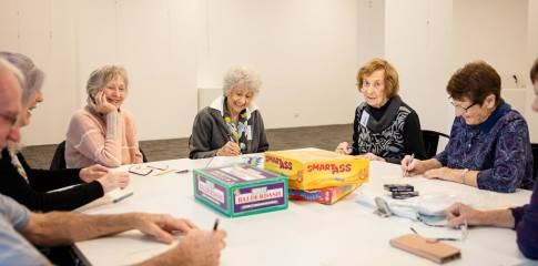 Group of seniors playing boardgames