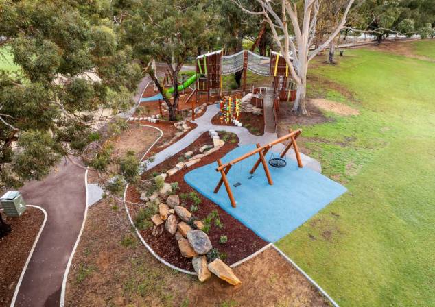Aerial photo of large wooden playground.