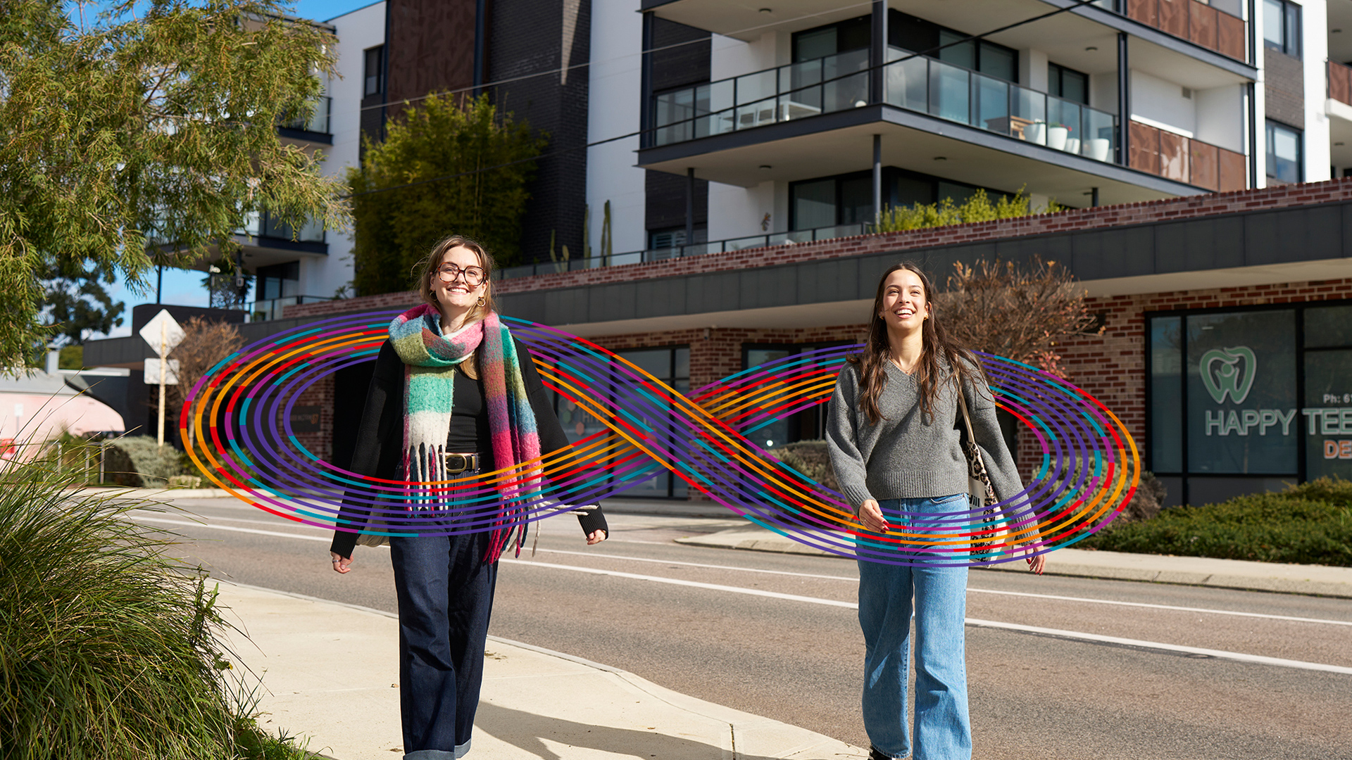 Two women walking on a street
