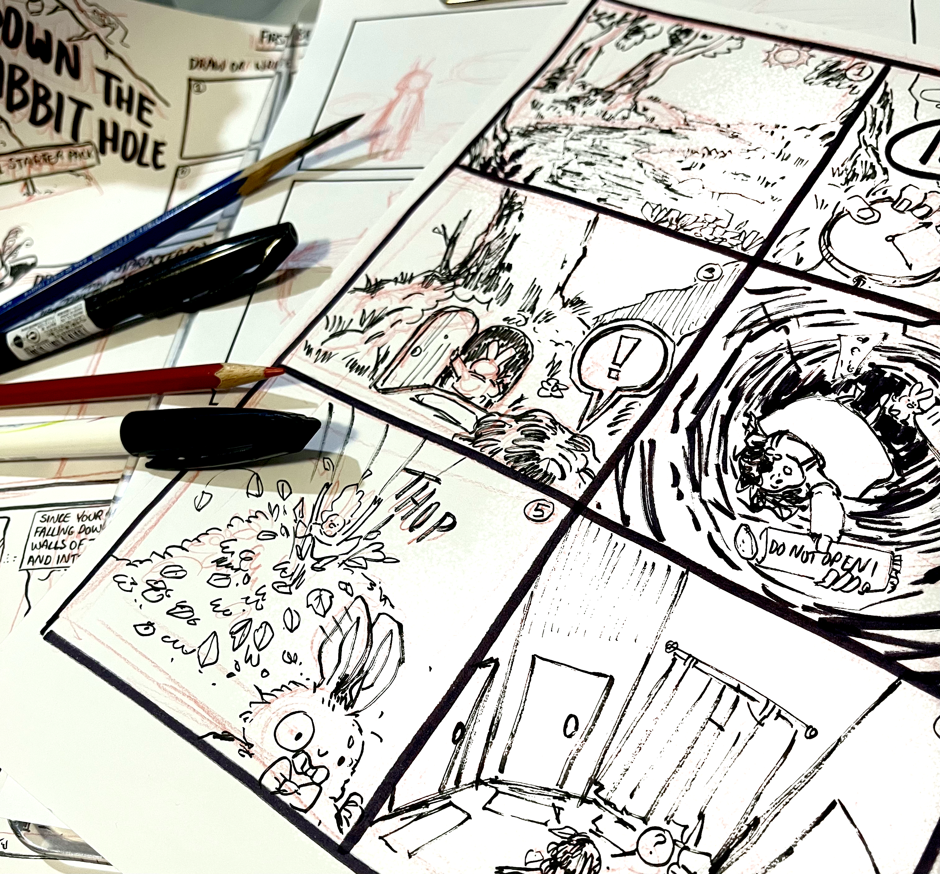 A comic book strip with pens sprawled 