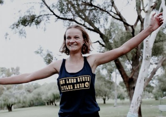 Photo of someone in running gear, arms stretched outward