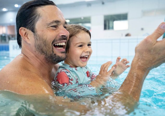 Family enjoying swimming lessons