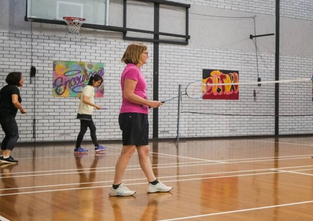 Women playing badminton