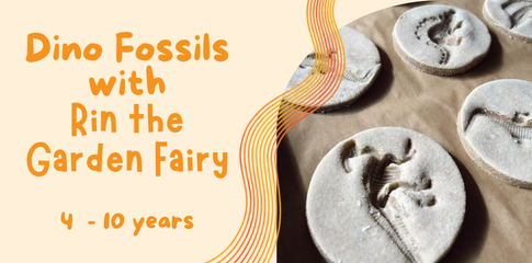An image of a crafted dinosaur fossil in a round salt dough puck sitting on a wooden bench.