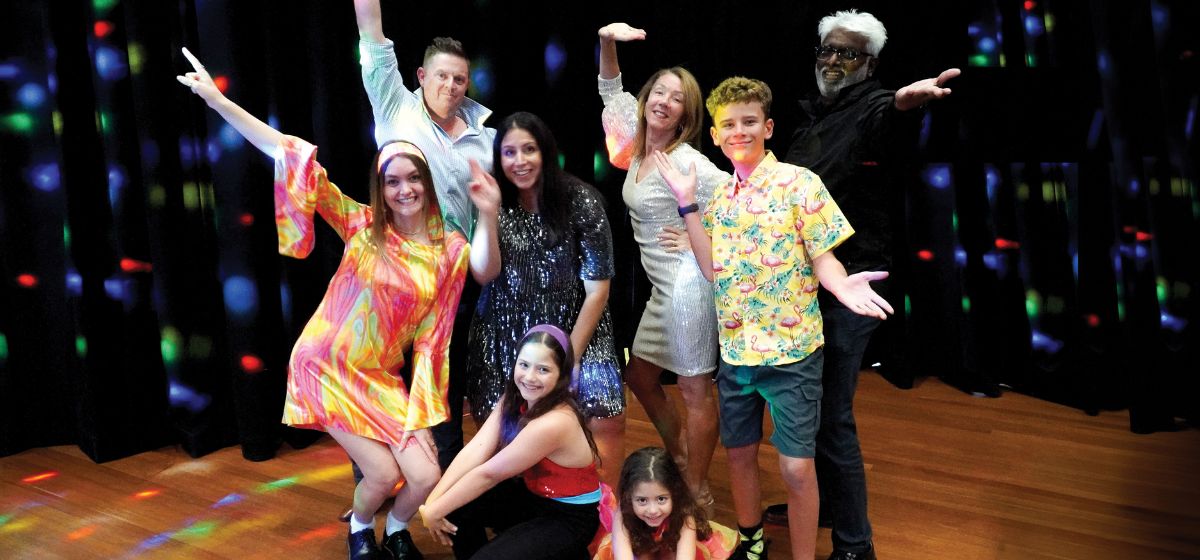 Image of people of all ages dancing at a disco