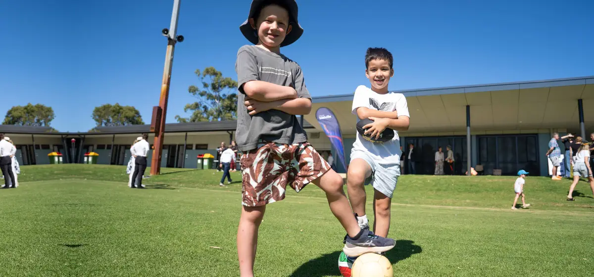 Two boys on a soccer ball