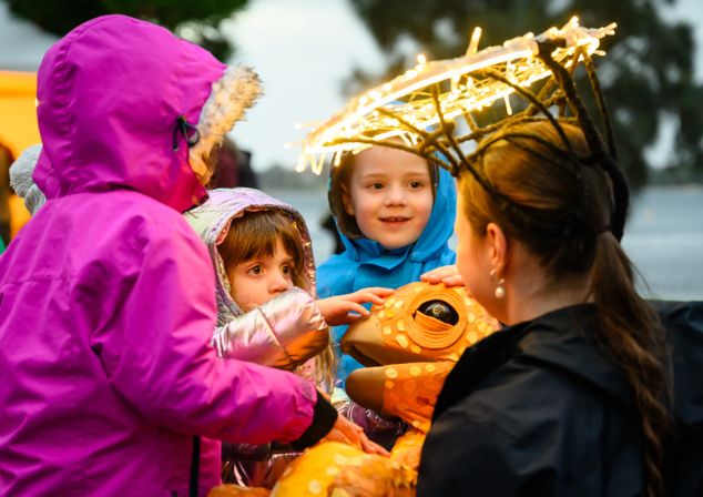 Kids interacting with a puppet at Melville Midwinter