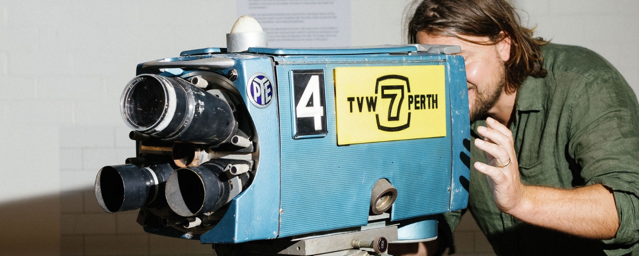Man pretending to use an old TVW 7 Perth video camera