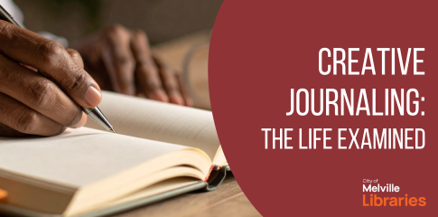 A hand writing in a journal.