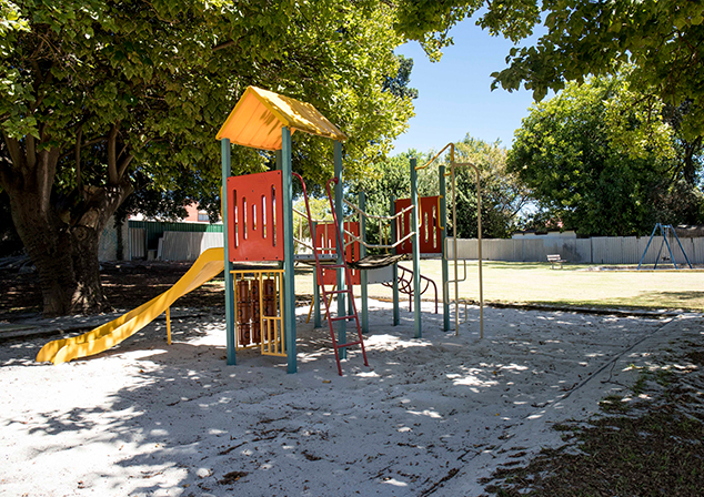 Image of playground equipment in sand pit.