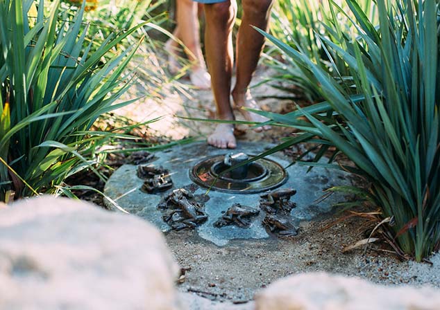 child walking through water element at piney lakes sensory play park