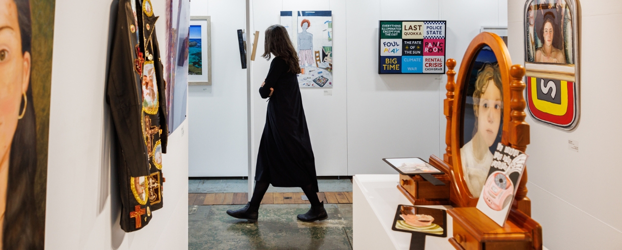 Woman admiring art at the Melville Art Awards