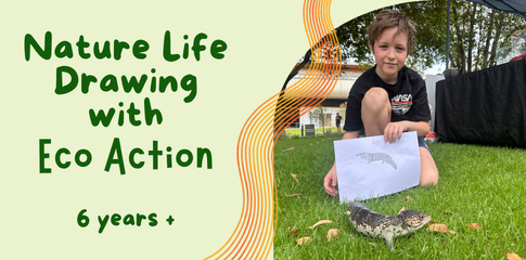 An image of a child holding a piece of paper with a drawing of a lizard. A real lizard is sitting in the grass in front of the child.