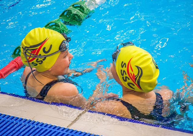 two young swimmers taking in the pool