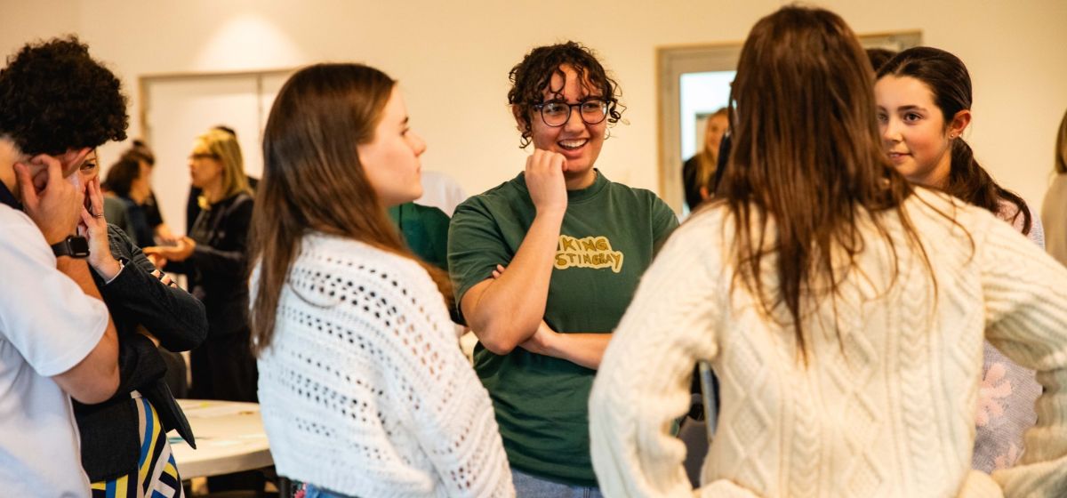 Image of young people talking and taking action