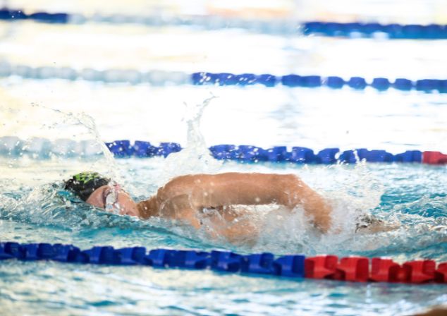 Person swimming in pool