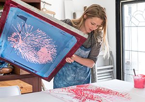 Artist checking art imprint